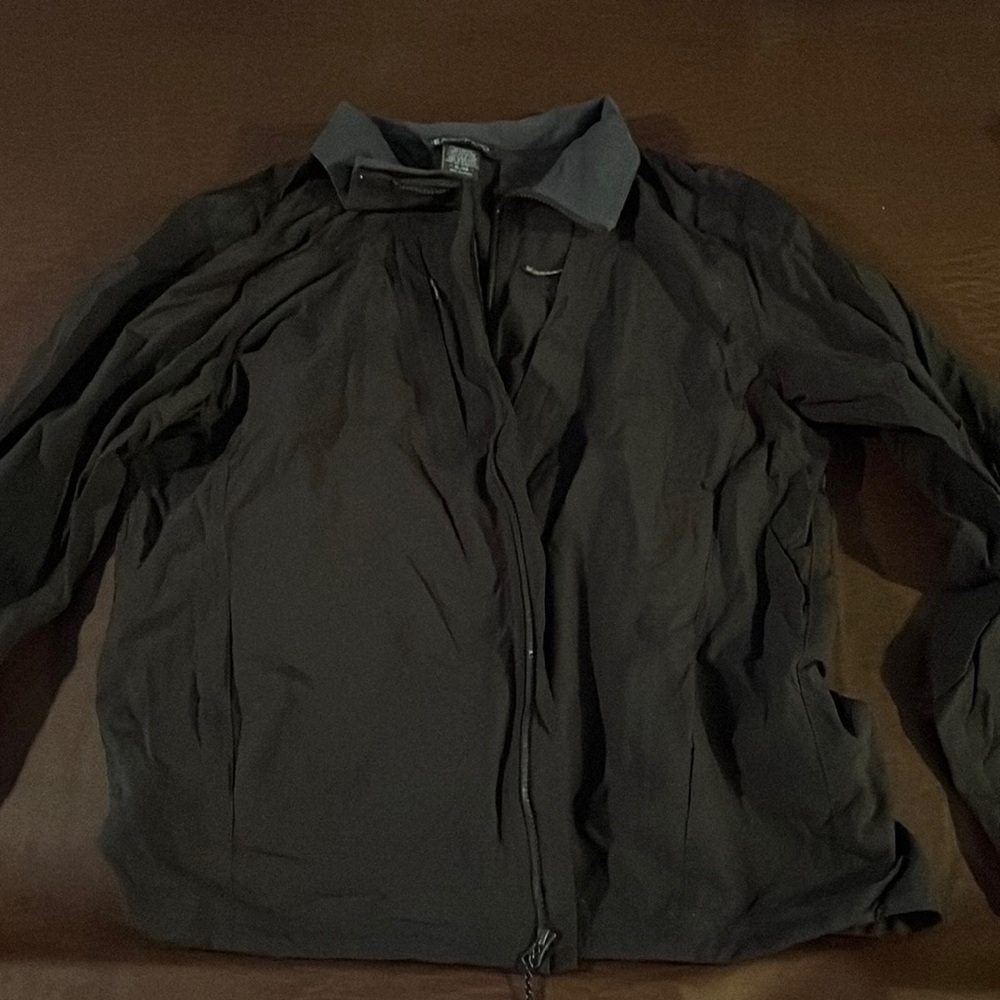 XL brownish ExOfficio coat with an unbelievable amount of pockets.